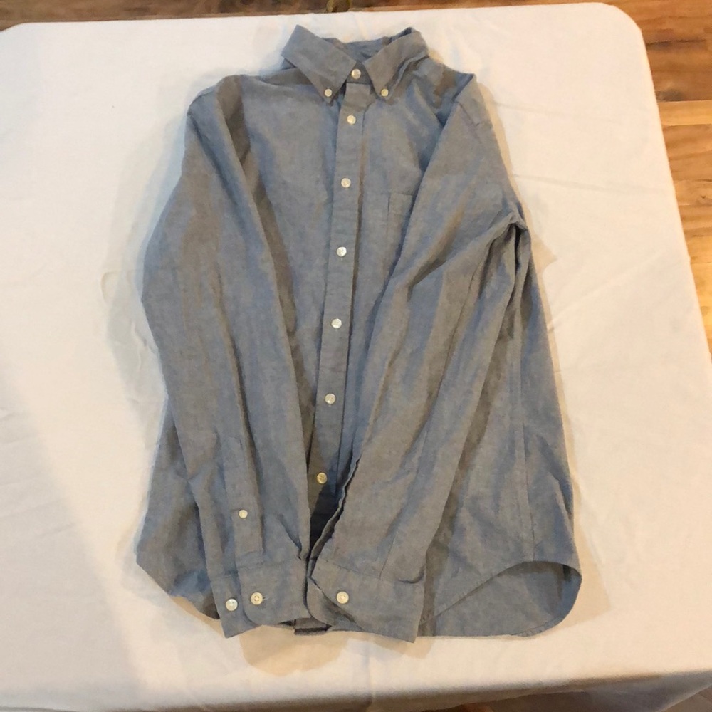 A blue buttoned downed collared shirt